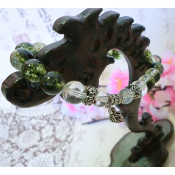 Green- flecked clear crystal beads bracelet with 925 silver double leaf charms
